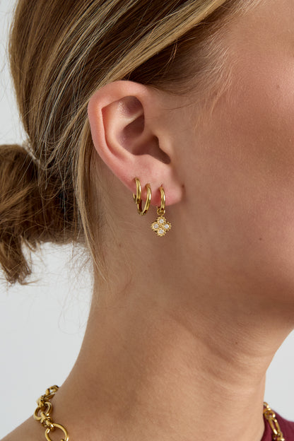 Small hoop earrings with zirconia-set clover charm